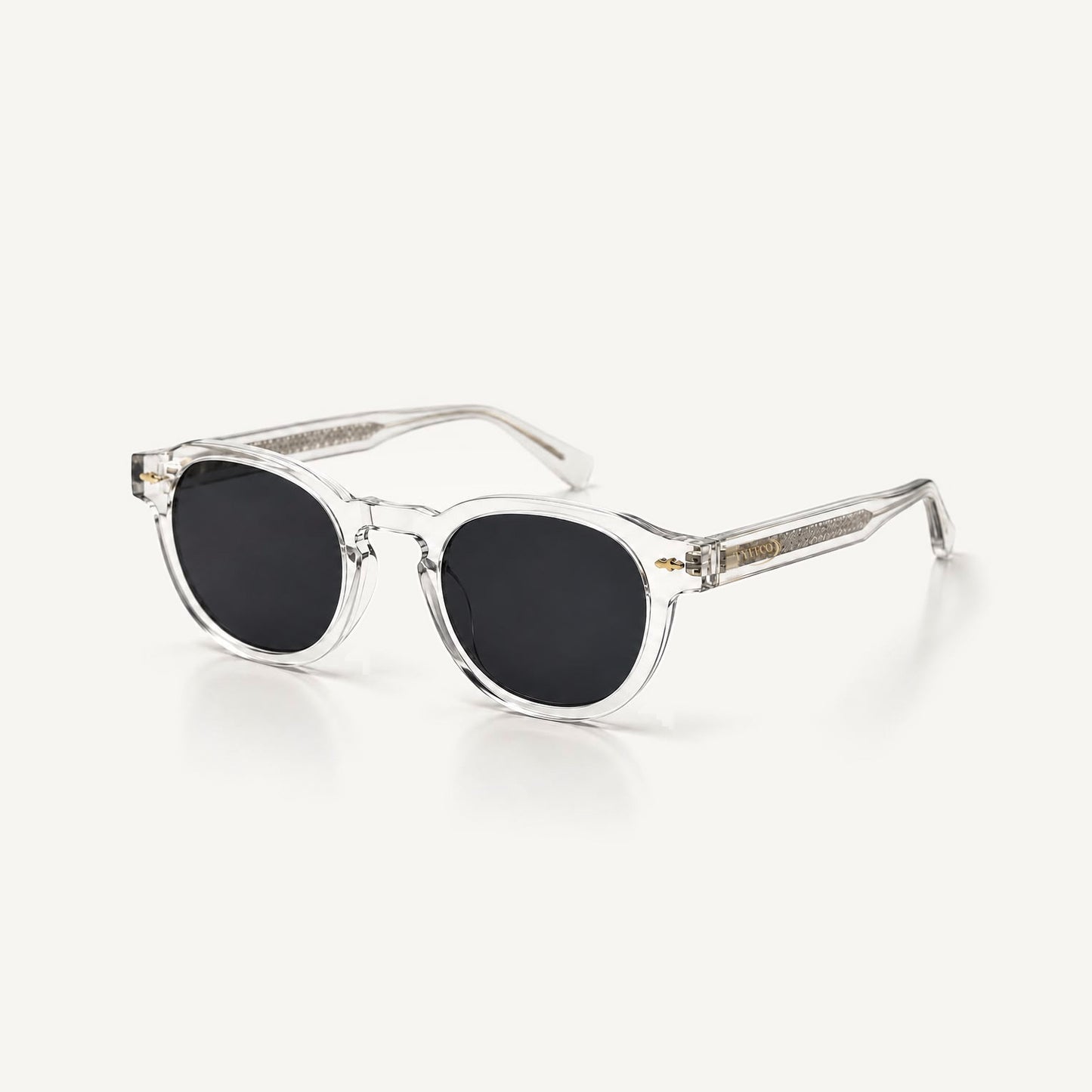 Tyffco Mônaco sunglasses in Crystal, three-quarter view, studio on off-white background.