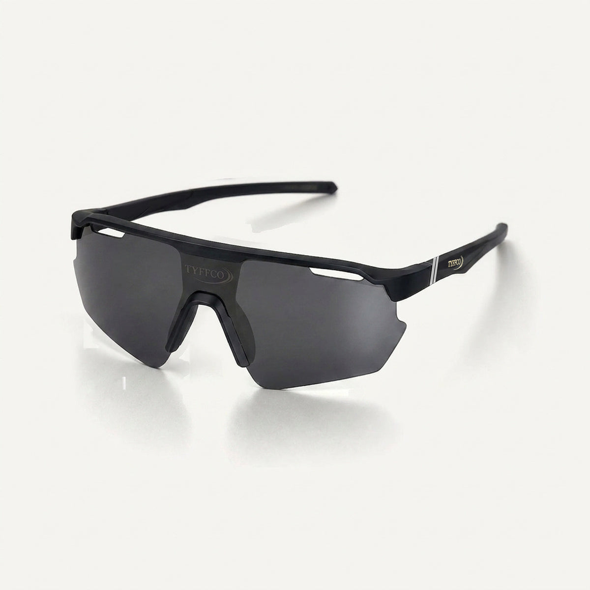 Tyffco Vittorio sunglasses in Black with smoke lens, gold TYFFCO mark and chrome band on the outer temple, three-quarter view, studio on off-white background.
